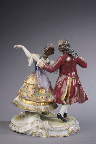 null Polychrome porcelain group showing a couple of gallant dancers (minor wear)....