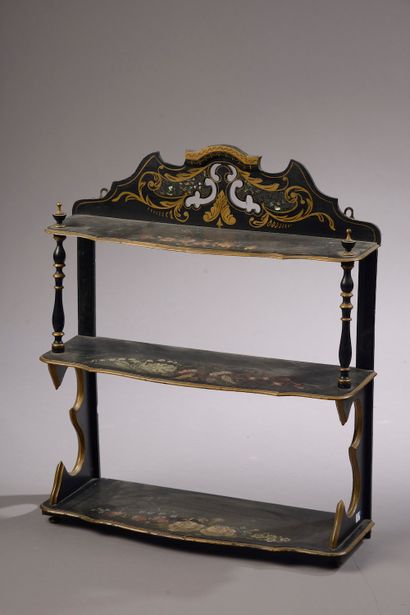 null A moulded, blackened and gilded wood wall shelf with polychrome flowers.

Napoleon...
