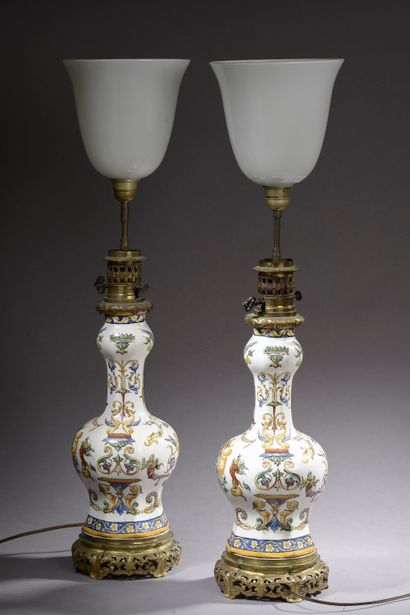 null Pair of earthenware table lamps with polychrome decoration of dolphins and grotesques...