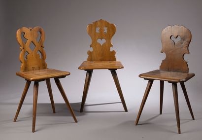 null Three wooden chairs with openwork backs (restorations, one seat split).

In...
