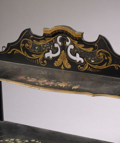 null A moulded, blackened and gilded wood wall shelf with polychrome flowers.

Napoleon...