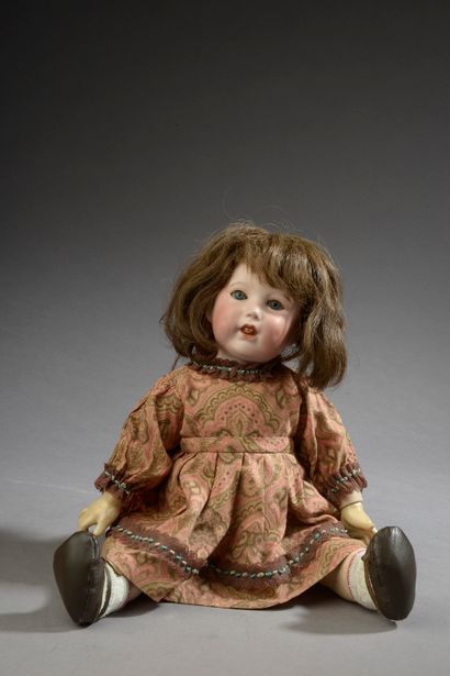 null SFBJ.

Porcelain head doll, open mouth, movable eyes and tongue (small lacks...
