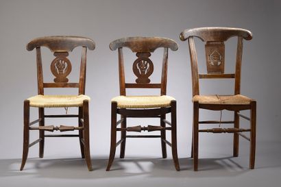 null Three chairs and two low armchairs in turned and carved wood, the back with...