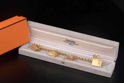 null HERMÈS.

18k yellow gold bracelet "La ronde des sacs" model with jaseron mesh...