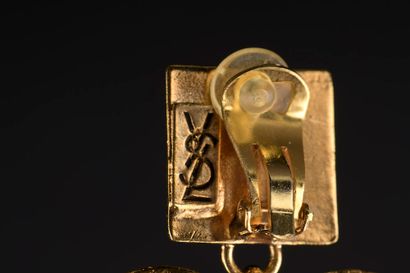 null YVES SAINT LAURENT.

A pair of gilt metal ear clips, the square plate with a...