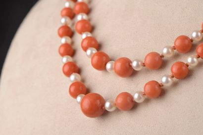 null A two-row necklace composed of ninety-seven cultured pearls and ninety-five...