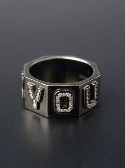 null Octagonal ring in blackened silver with small round brilliant-cut diamonds.

Finger...
