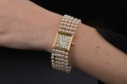 null CHANEL.

Ladies' wristwatch model "Mademoiselle", the square case in 18k yellow...