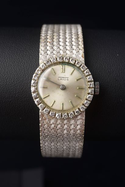 null LATOS.

Ladies' wristwatch in 18k white gold, the circular case with bezel engraved...