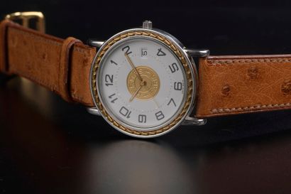 null HERMÈS.

Men's wristwatch model "Sellier", the round case in steel and gilded...