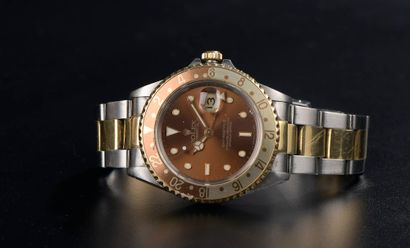 null ROLEX.

Men's wristwatch in steel and 18k yellow gold model "Oyster Date GMT-Master...