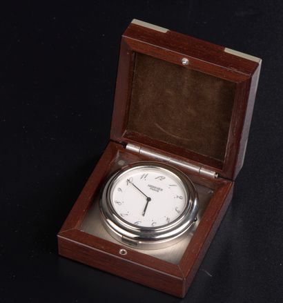 null HERMÈS.

Steel travel clock model "Arceau" the circular case, the white enamelled...