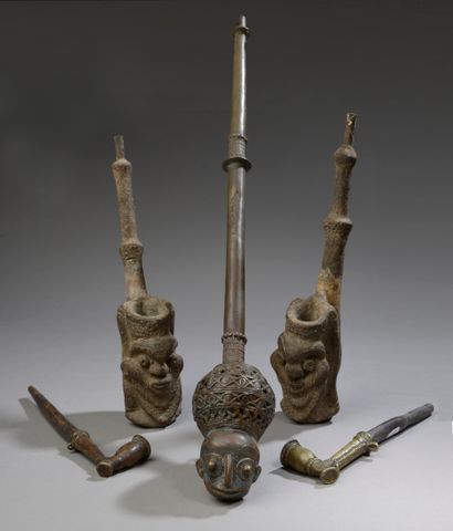 null Set of five pipes: 

- Two AKAN pipes, Ivory Coast.

Wood and lost wax bronze.

Length...