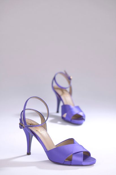 null YVES SAINT LAURENT.

Pair of purple satin heeled sandals with ankle strap closure.

T....