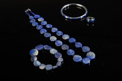 null Set including a silver ring and a necklace set with lapis lazuli plates.

Diameter...