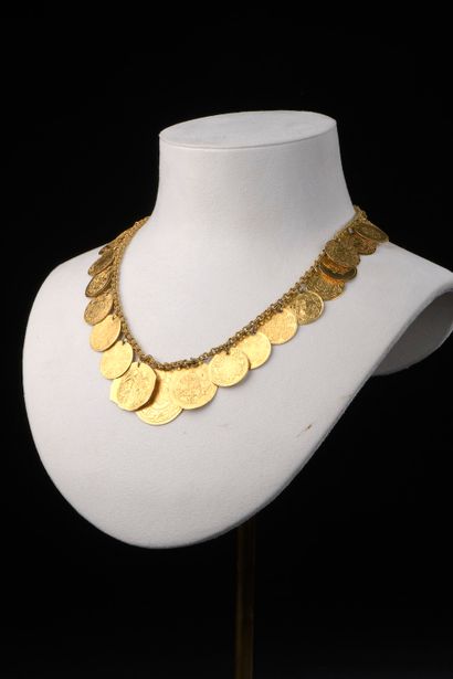 null An 18k yellow gold necklace with doubled jaseron mesh holding thirty-one Turkish...