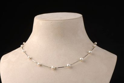 null Necklace in 18k white gold with baton links punctuated by thirteen cultured...
