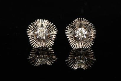 null A pair of 18k white gold earrings with a scrolled flower design, set with a...