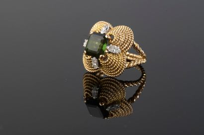 null 18k yellow gold ring, the filigree corbel bezel set with a 3 ct green tourmaline...