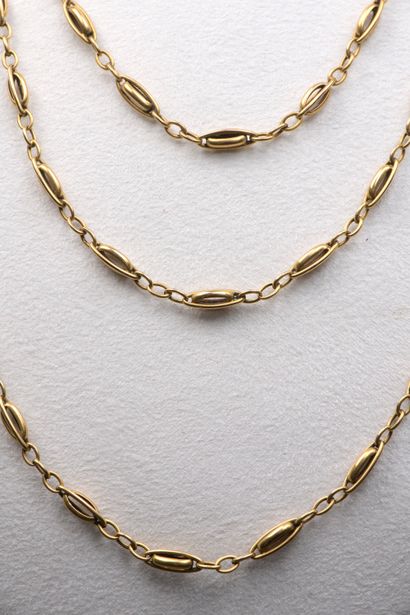 null 18k yellow gold long necklace with oval filigree and openwork links.

Late 19th...