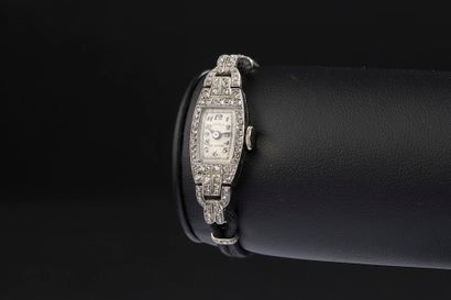 null JUVENIA. 

 Ladies' wristwatch, the tonneau-shaped case in 18k white gold and...