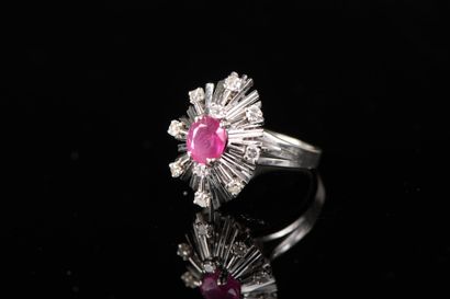 null Marquise ring in 18k white gold and 850 thousandths platinum with an oval ruby...
