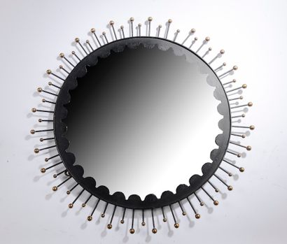 null 
Circular mirror in black metal and radiating points in gilded metal.




1950's.




Diameter...