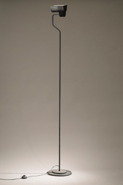 null Halogen floor lamp, the tubular shaft in black lacquered metal, the circular...