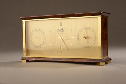 null HERMÈS.

Desk clock in brushed gilt metal and lacquered in imitation of brown...