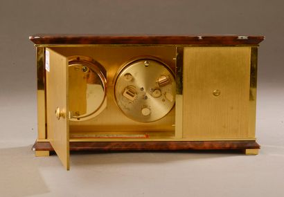 null HERMÈS.

Desk clock in brushed gilt metal and lacquered in imitation of brown...