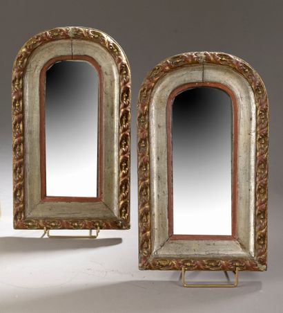 null 
A set of two carved and gilded wood mirrors, one with a shell pediment and...