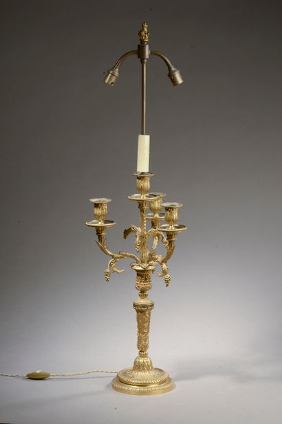 null 
Gilt bronze candelabra with four arms of light decorated with pampers, the...