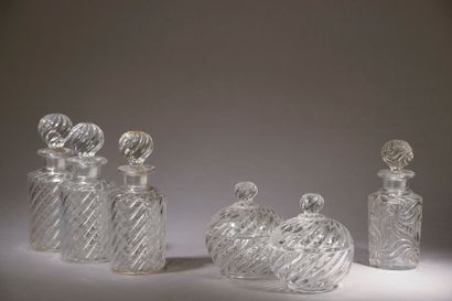 null BACCARAT. 

 Three flasks and two toilet boxes in moulded-pressed crystal with...
