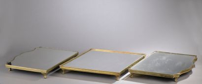 null Table top in three parts in bronze, formerly silvered, with ice bottom. The...