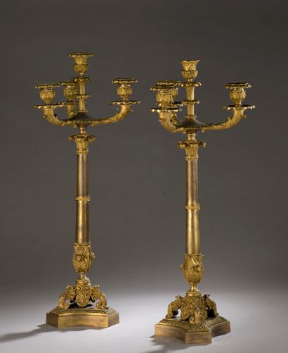  A pair of chased and gilt bronze candelabras...
