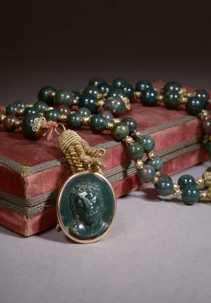  Rosary with round beads of blood jasper holding in pendant an oval medallion also...