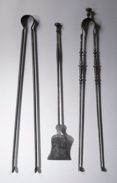  A cast iron hearth set consisting of a shovel and two tongs. XIXth century. Height...
