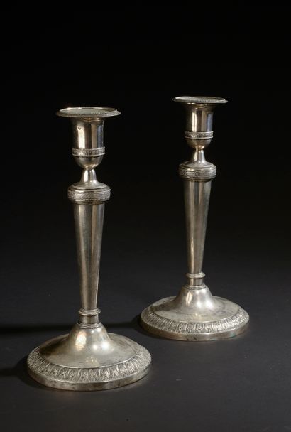 Pair of silver torches with repoussé decoration...