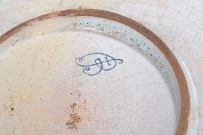 null ROUEN. 

 Large earthenware dish with blue monochrome decoration, the basin...