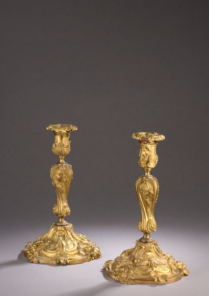 Pair of chased and gilt bronze torches decorated with rocaille, fruits and insects...