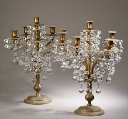 null A pair of five-light brass girandoles with engraved scrolls and pearl-shaped...