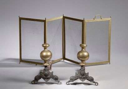  Pair of cast iron and brass "marmousets" andirons (wear, oxidation). 19th century....