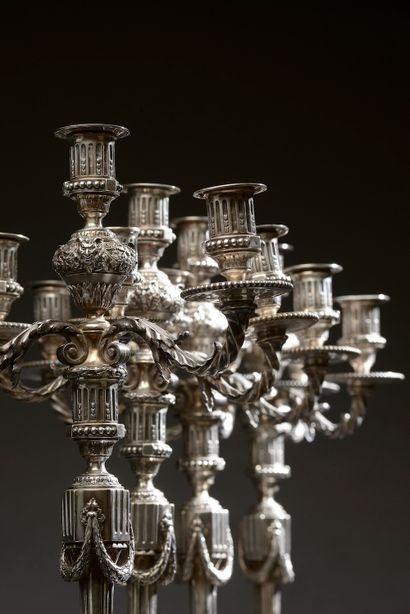 null 
Suite of four large silver candelabras, the shaft with triglyphs and garlands...