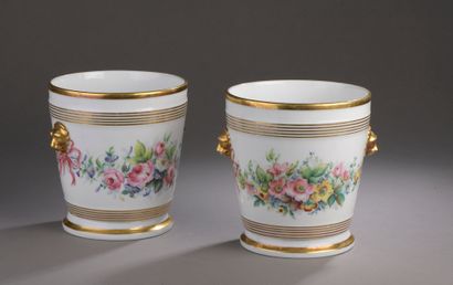  PARIS. A pair of porcelain planters with polychrome decoration of flowered garlands,...
