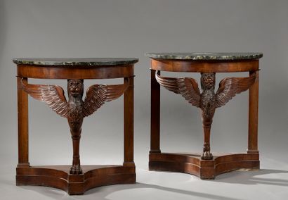 null Pair of half-moon consoles in mahogany and stained wood veneer, resting on a...