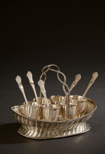 Silver egg set with simulated basketry decoration...
