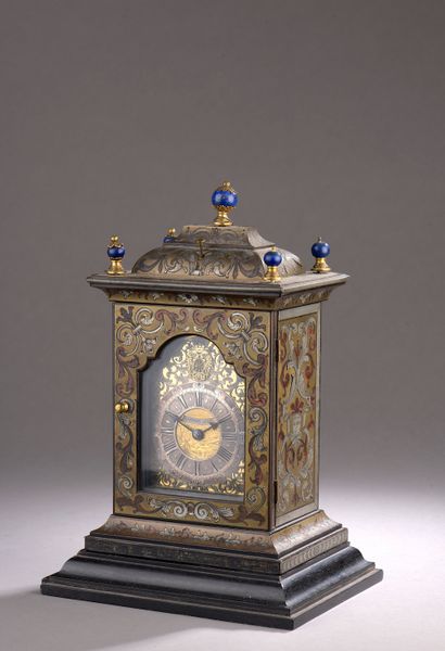  A "religious" clock in marquetry known as "Boulle" in pewter and brass decorated...