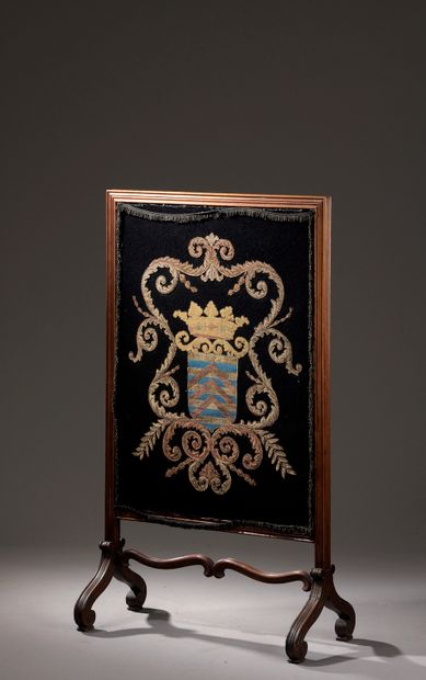  Mantelpiece in molded wood resting on scrolled runners, the leaf embroidered with...
