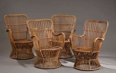 Set of four rattan wraparound armchairs, the circular hourglass seat (wear and tear,...