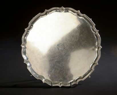 Round silver tray with contours resting on...